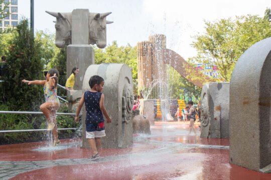 Kids play in the water area at Chelsea Waterside Playground
