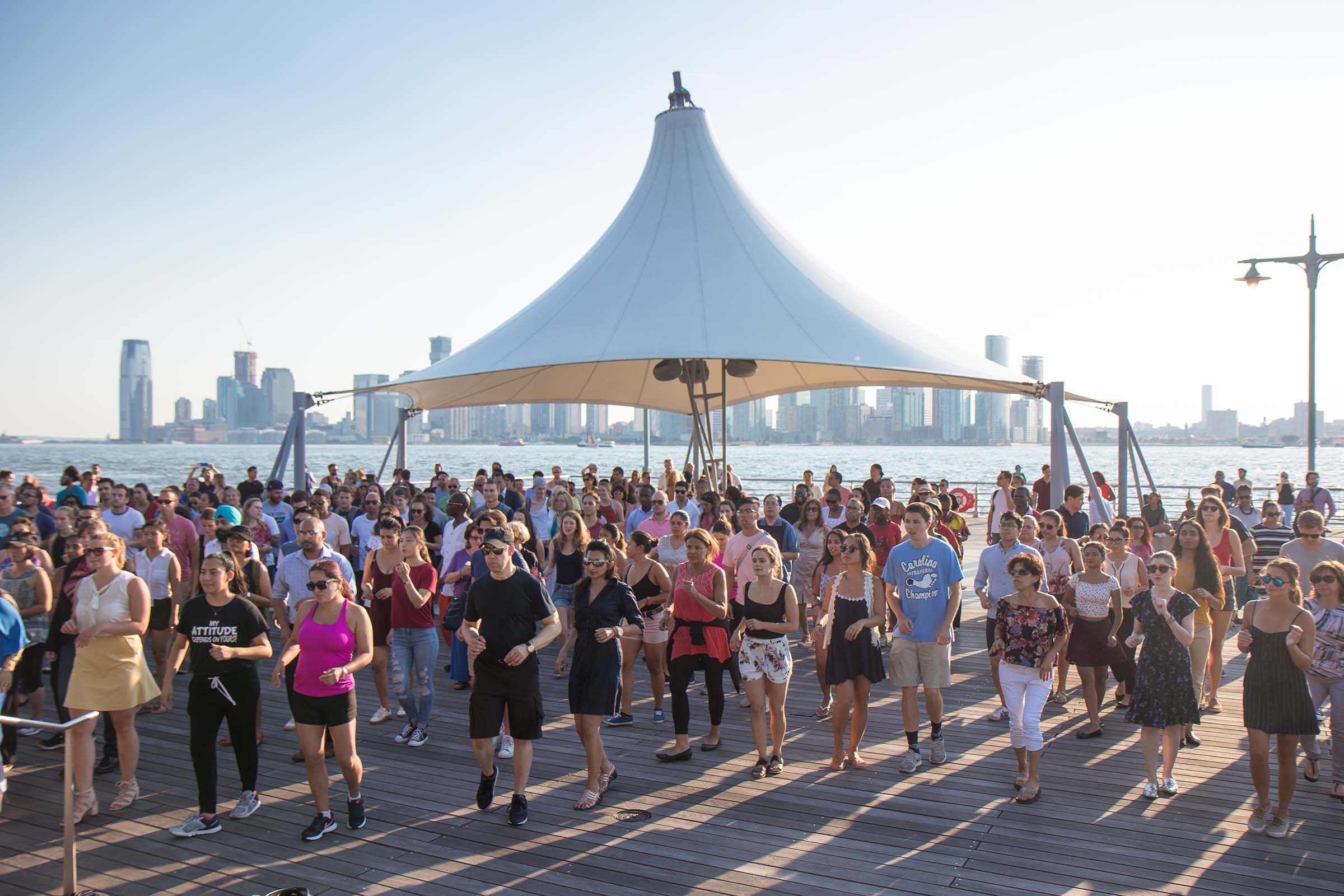 Under the canapé at Pier 45, Park visitors learn how to salsa dance