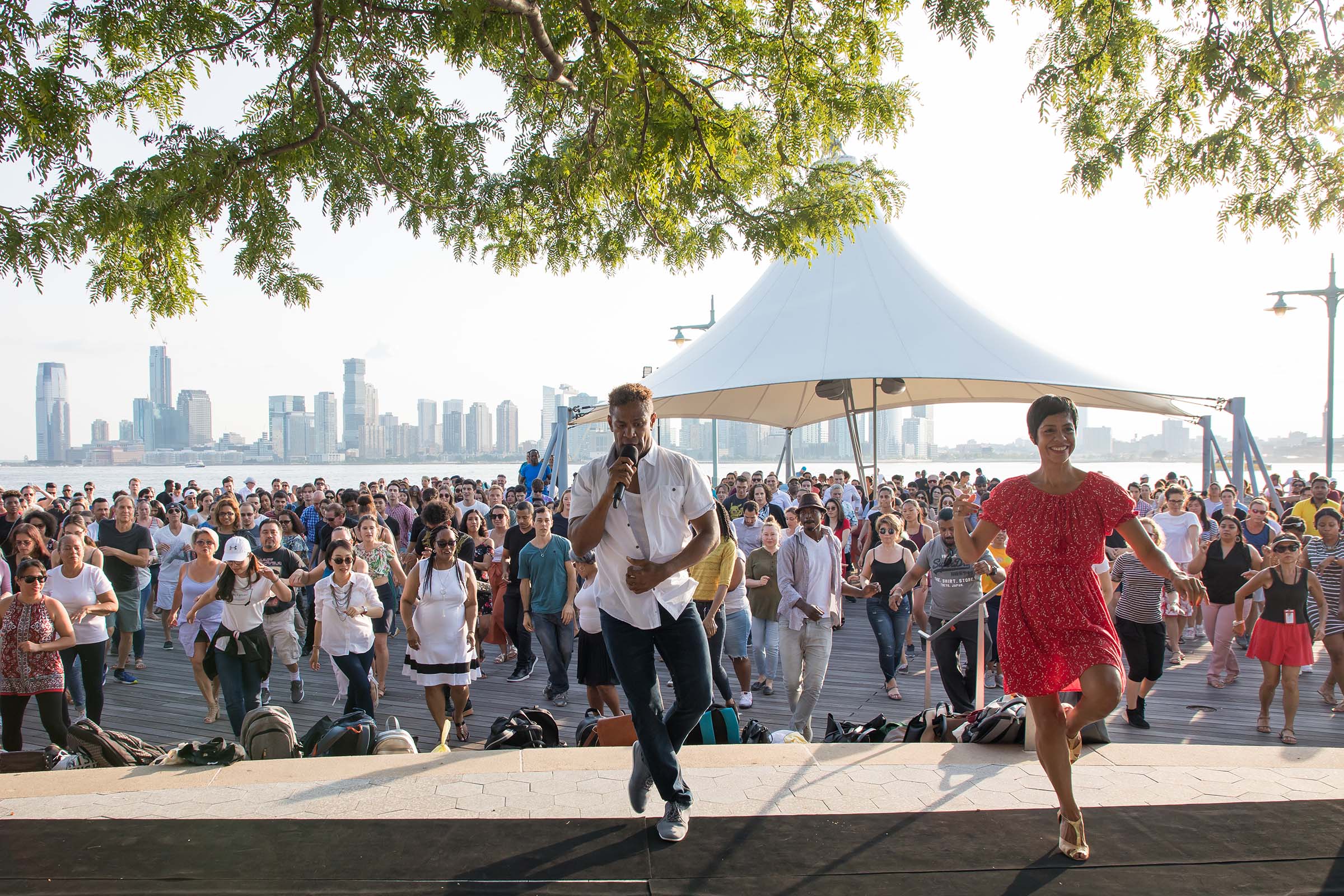 Talia raises her leg as she preps the next dance move during Sunset Salsa at Pier 84