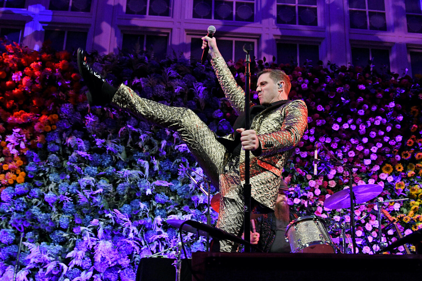 Scissor Sisters lead singer Jake Shears kicks his leg up
