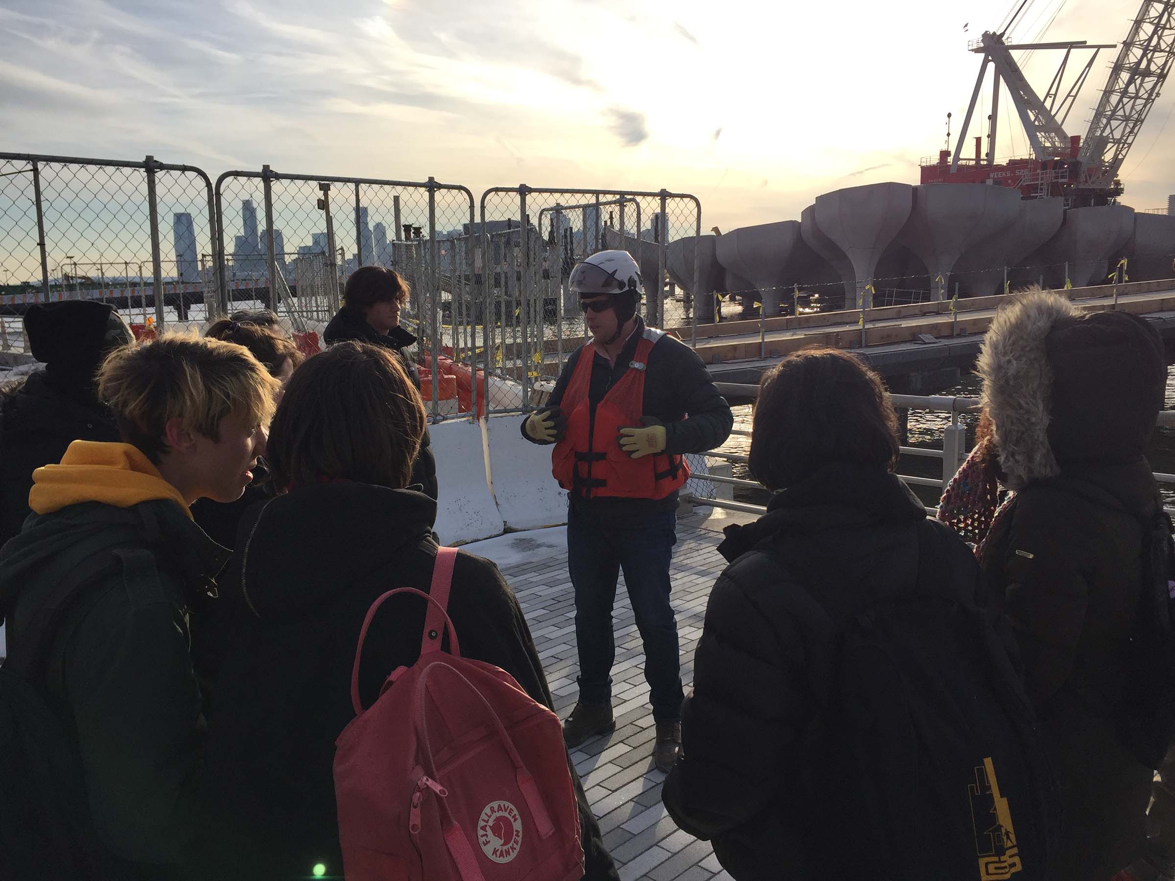 A group of students looking at the construction at Pier 55
