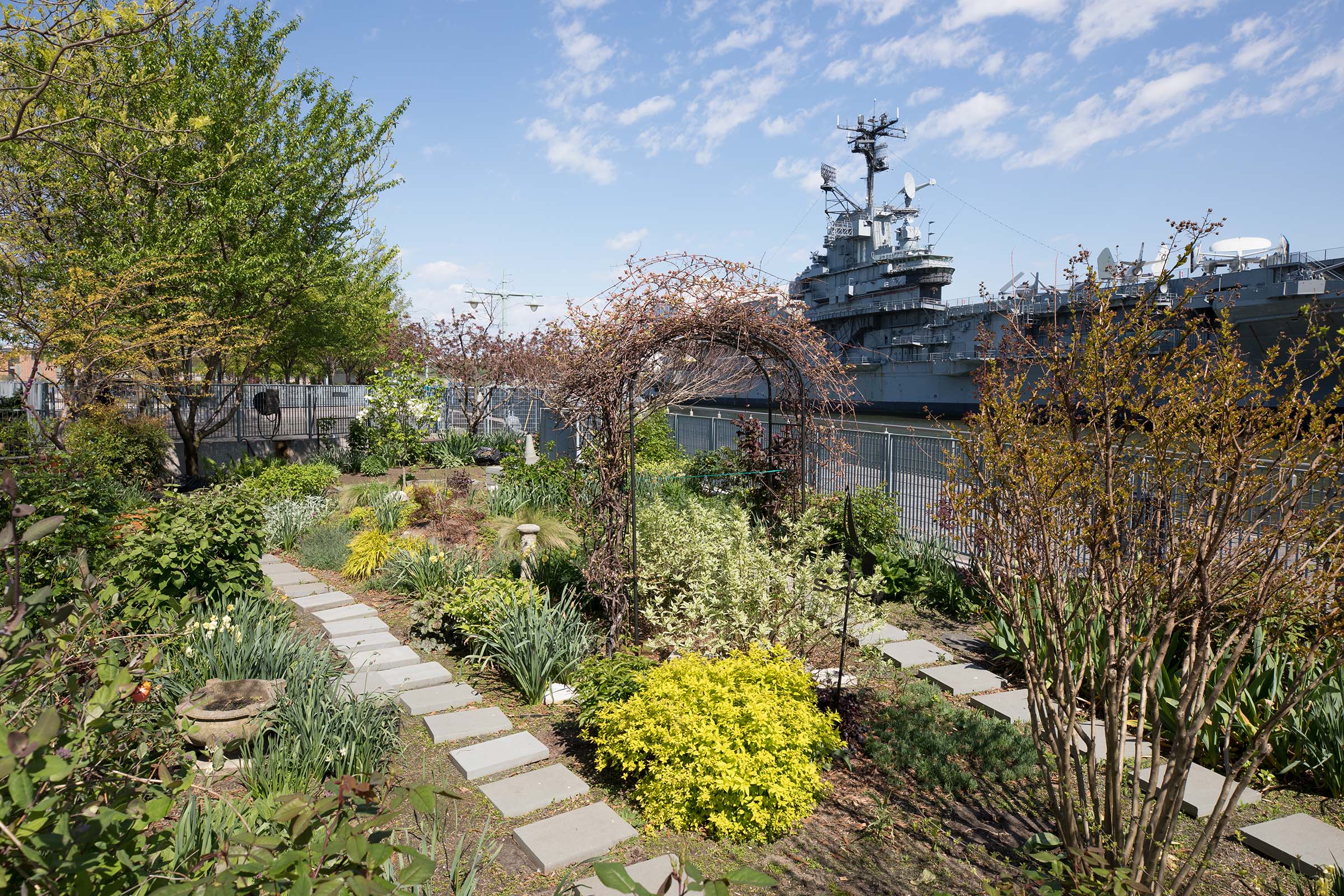An oval trellis is a centerpiece in the community garden