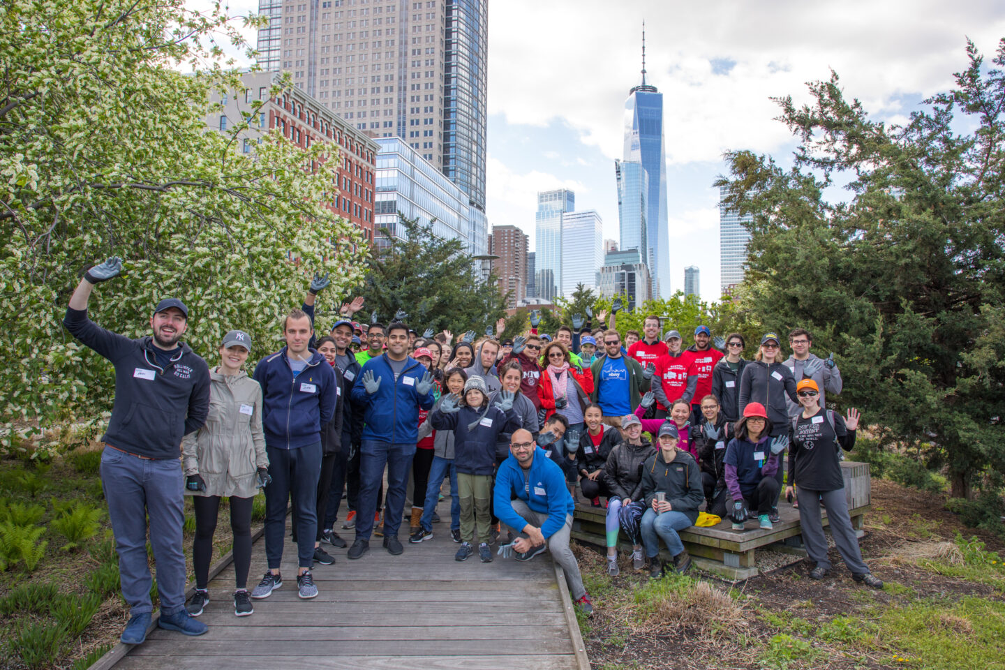 A group of volunteers standing together for a photo on the Tribeca Native Boardwalk