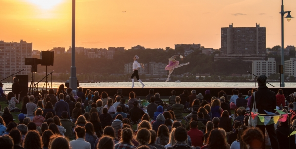 Dancers leap as the sun sets behind them in Hudson River Park