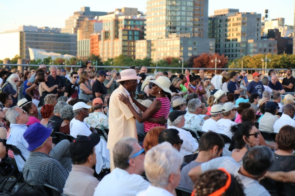 A couple decide to start dancing during the Blues performance at Blues BBQ in Hudson River Park