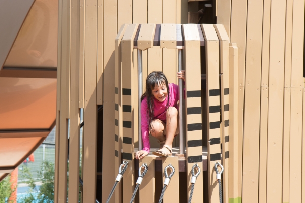Kids enjoy climbing around the pipefish slide at Chelsea Waterside Play Area