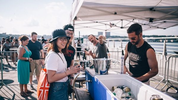 Blues BBQ visitors quench their thirst during the hot summer day