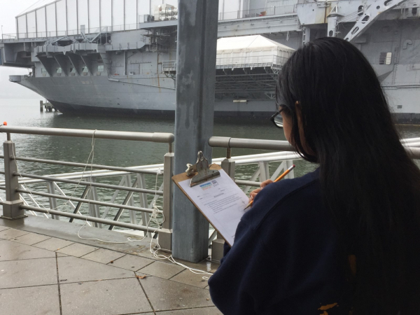 A scientist writing down her findings from the day's research