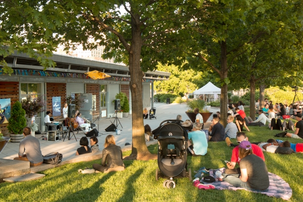 The sun beams on Park visitors at Jazz at Pier 84 in Hudson River Park