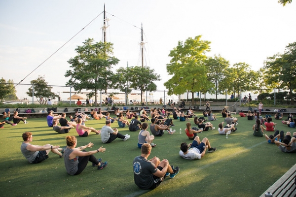 Fitness buff enjoy yoga on the lawn at PIer 25