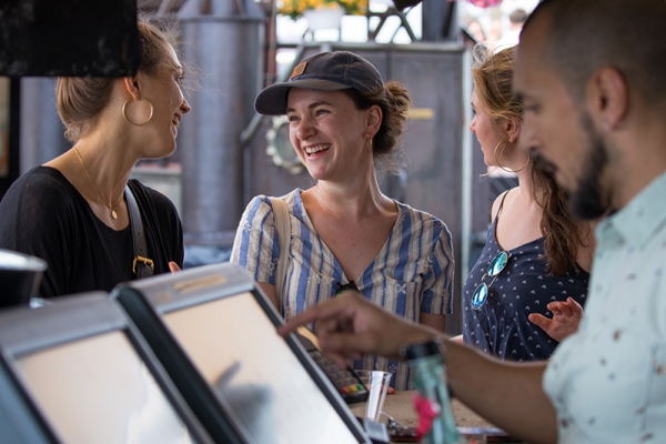 Park visitors order food at the Frying Pan