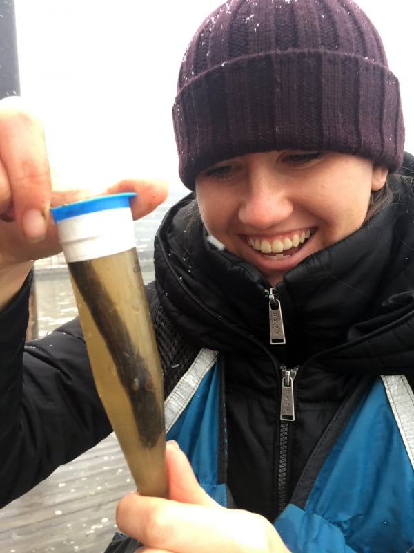 HRPK scientist looks at the plankton form the river with a joyous expression