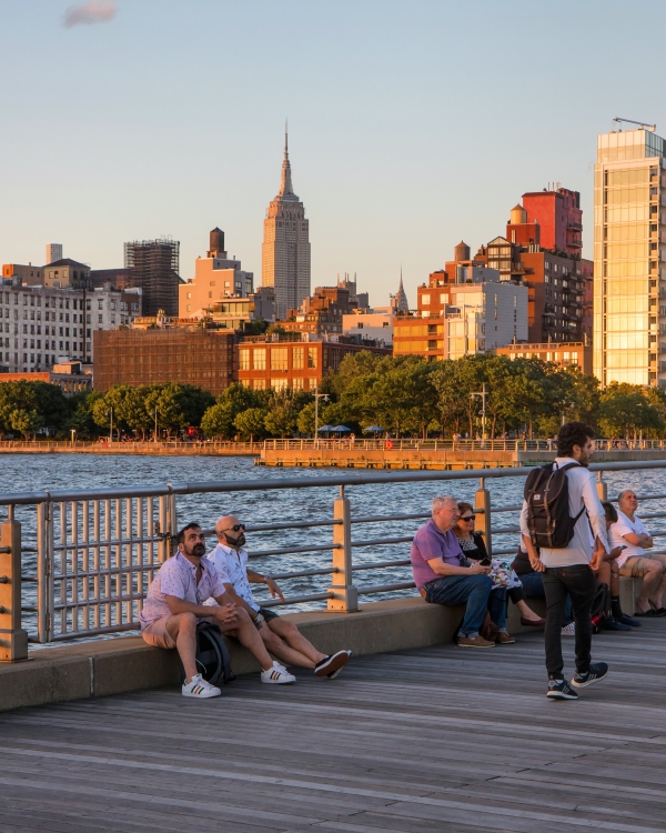 Kids and Park visitors sit on Pier 45 esplanade