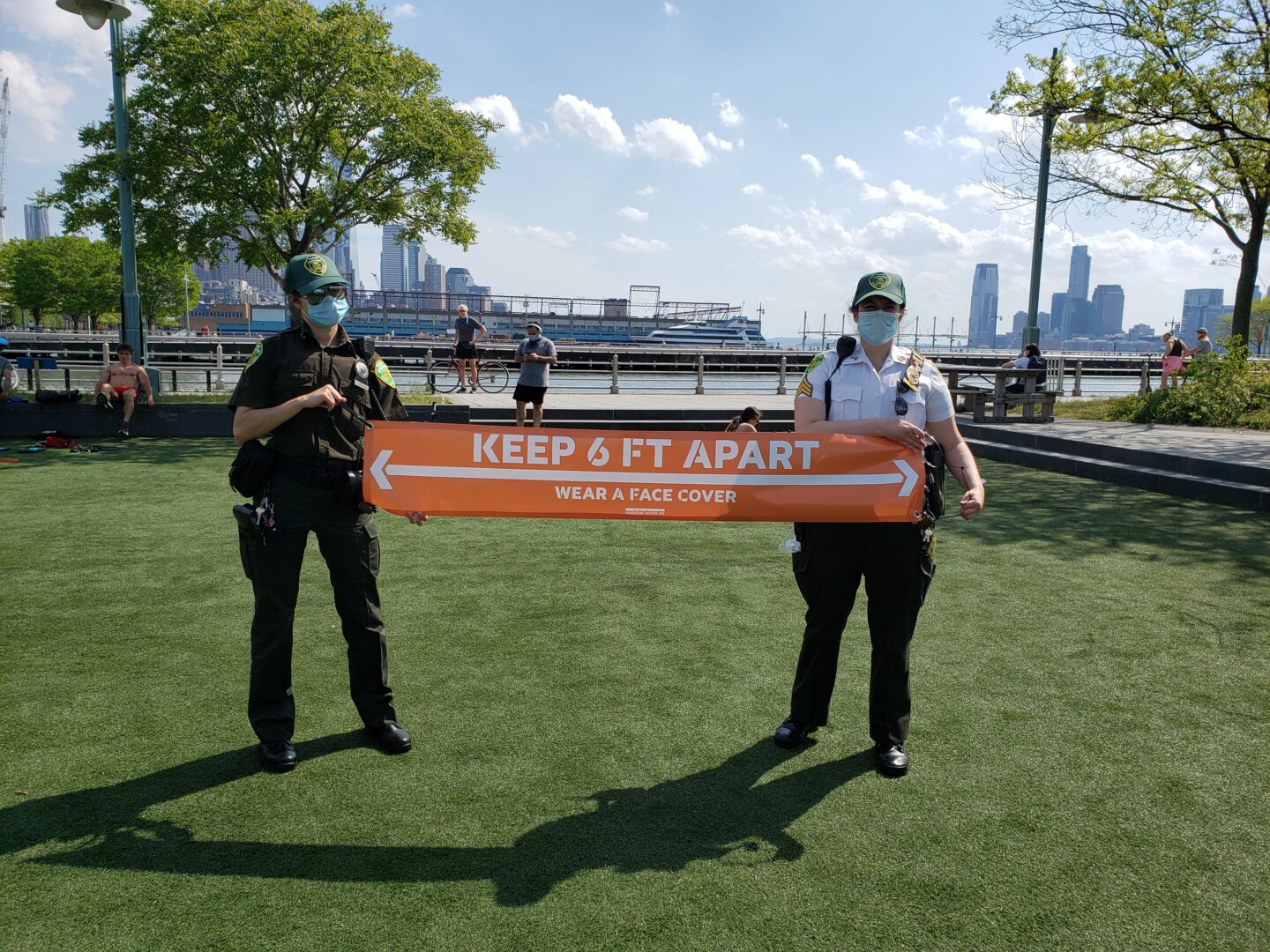 officers on pier social distancing