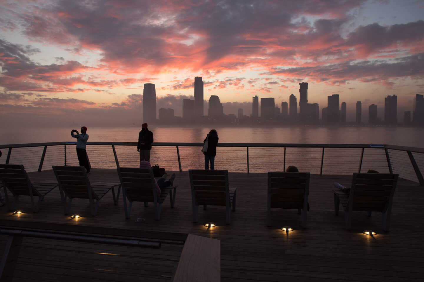 People watching the sunset from the western end of Pier 26
