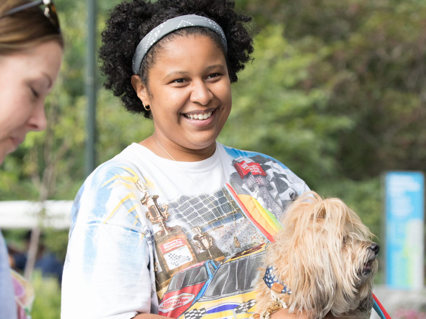 dog being held by owner at chelsea waterside dog reception