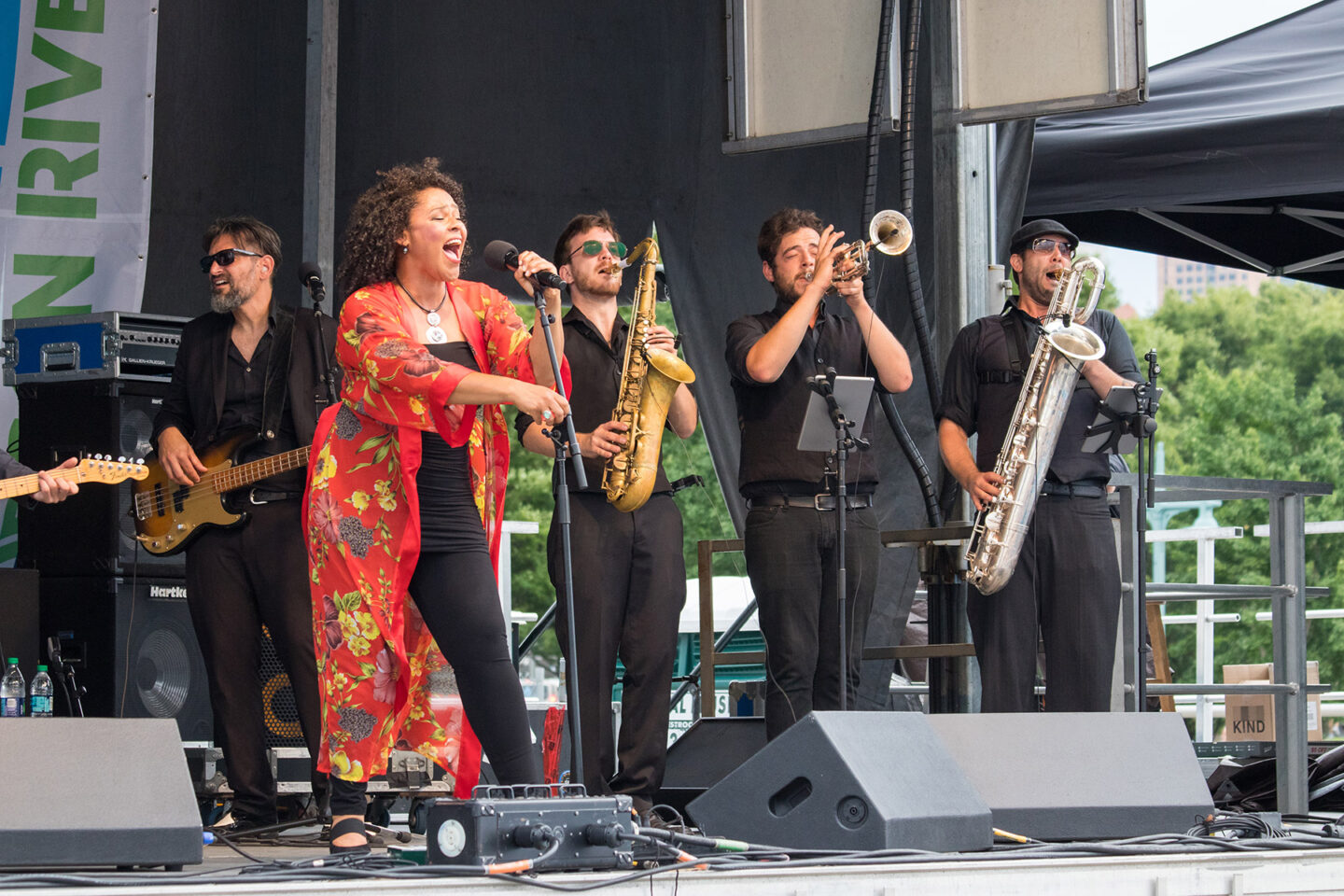 Blues singer on stage at HRPK along with 5 band members during a performance