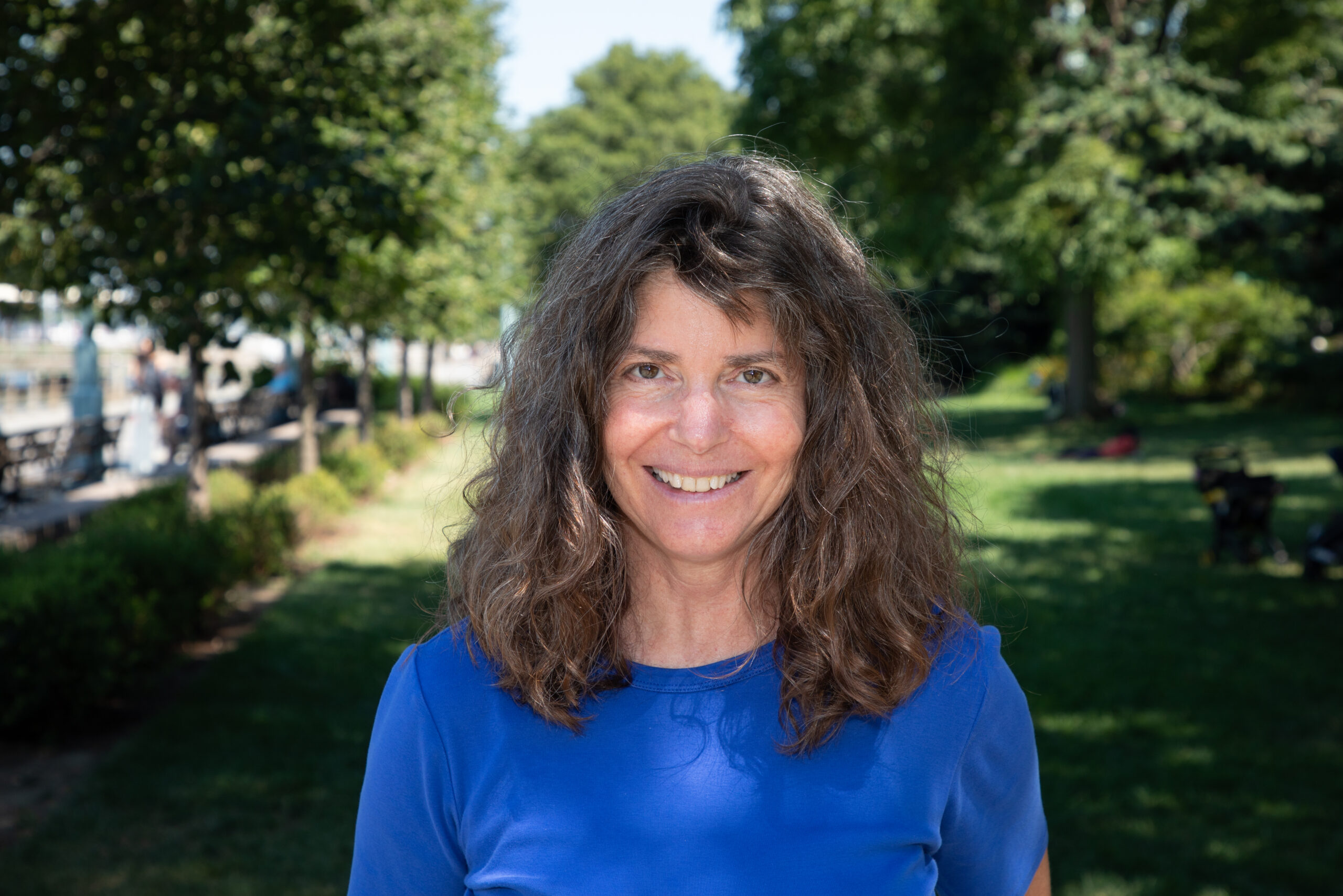 Professional headshot of Christine Fazio on a Hudson River Park lawn