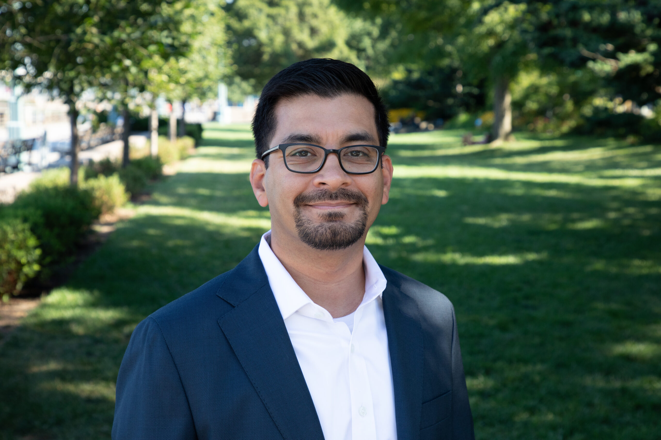 Professional headshot of Robert Rodriguez on a Hudson River Park lawn