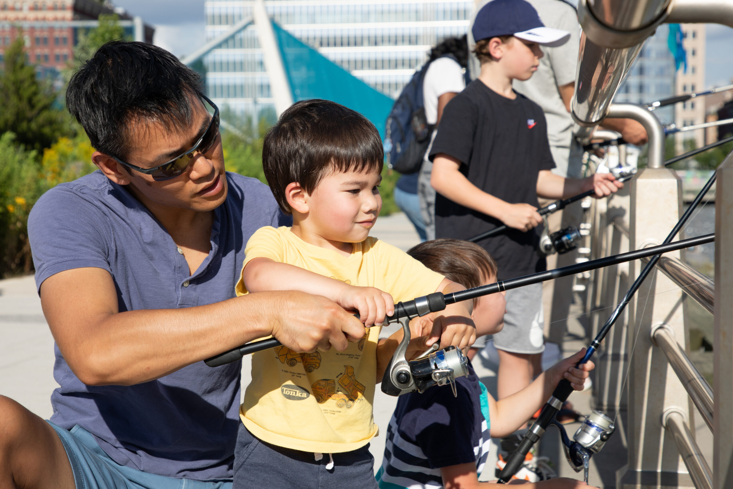 Father and son fish at Hudson River Park's Pier 26