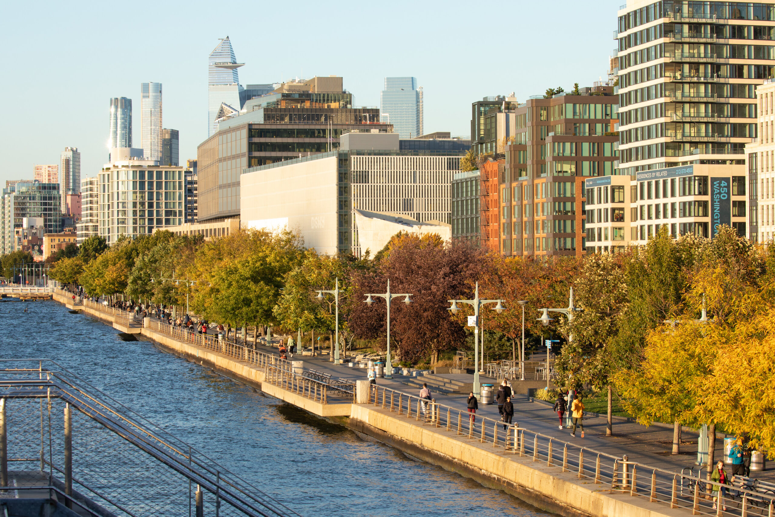 Hudson River Park's treelined esplanade featuring peak autumn foliage