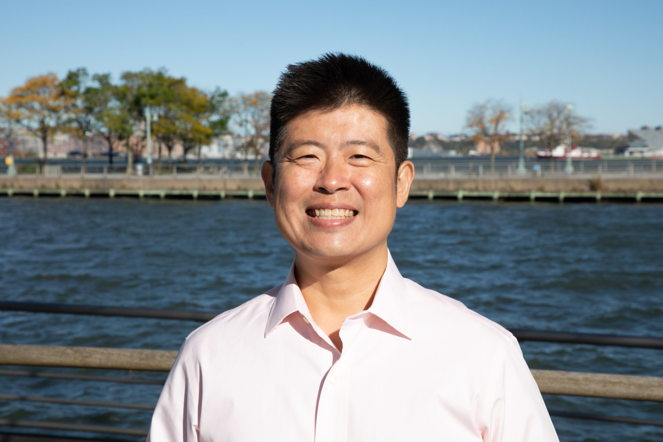 Professional headshot of Steven Chang on a Hudson River Park pier