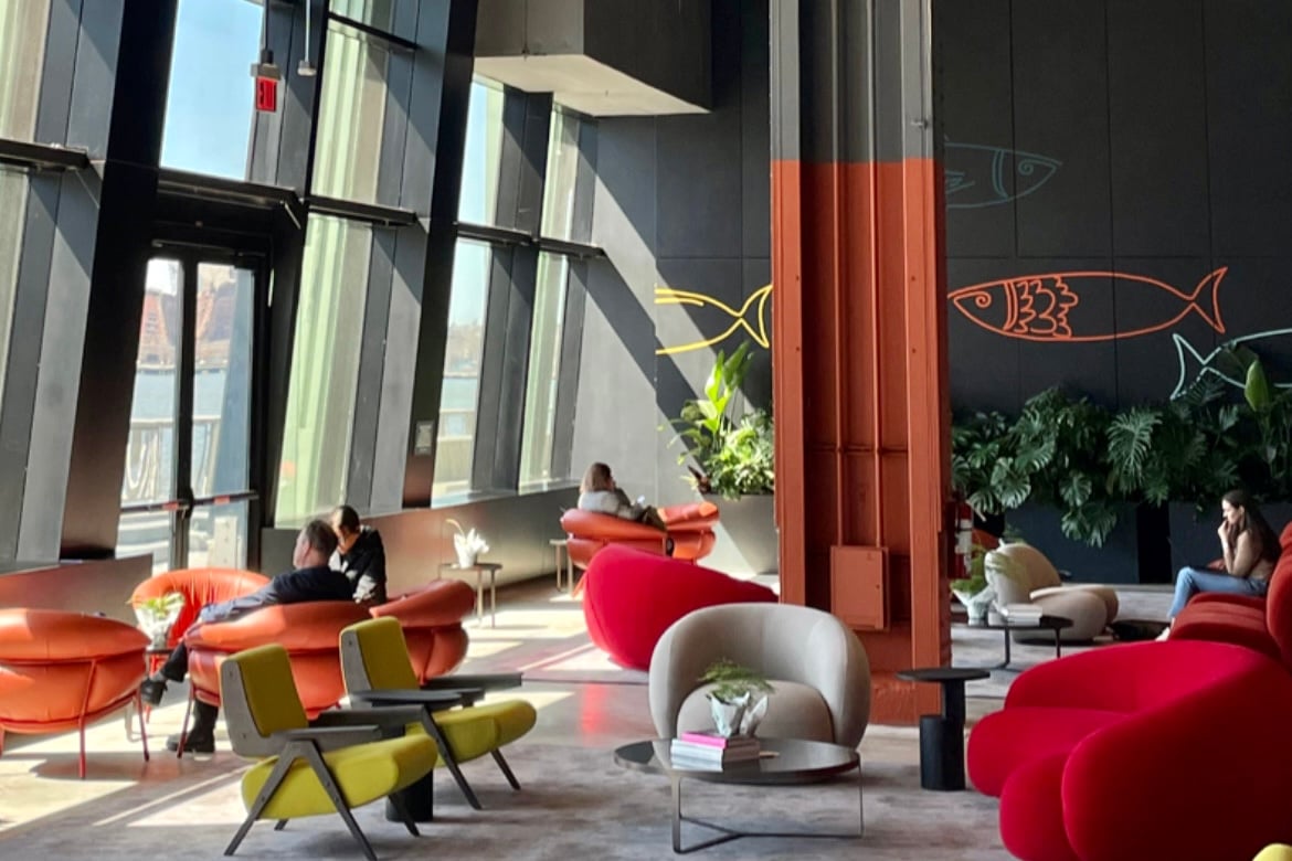Cozy chairs and couches placed throughout the Living Room at Pier 57