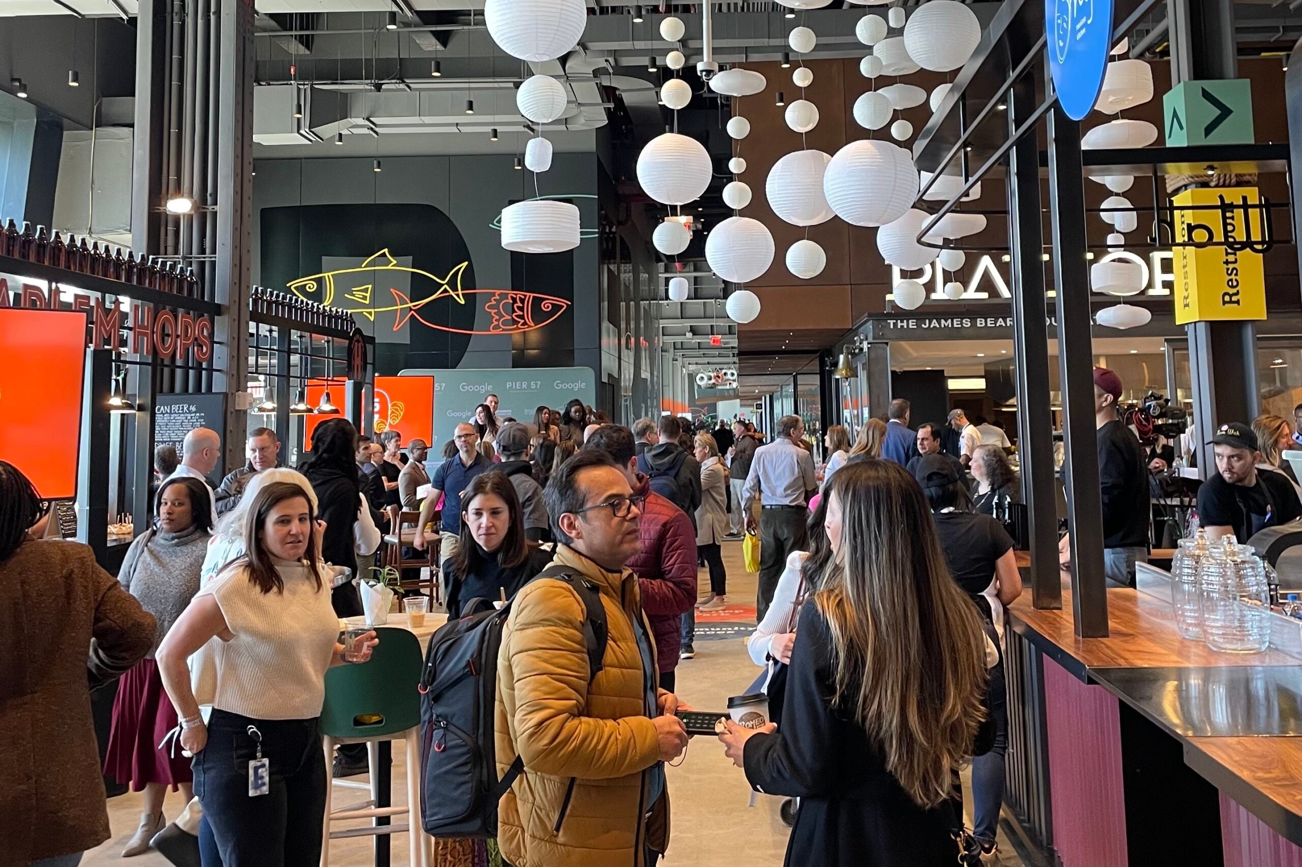 People lined up to order at a Market 57 shop