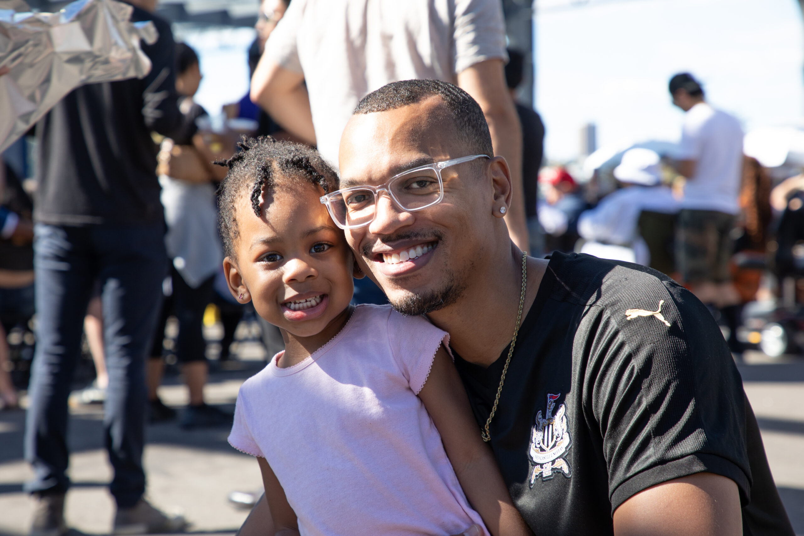 father and daughter smiling at Blues BBQ