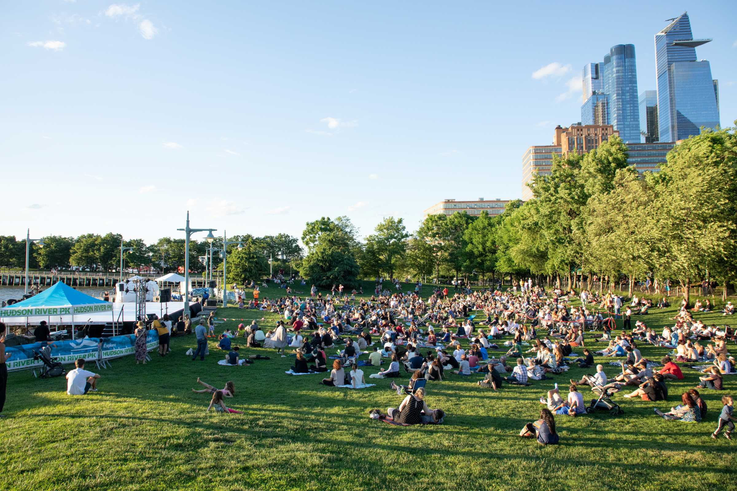 The Hudson River Dance Festival audience on the Pier 57 lawn, with Hudson Yards in the background