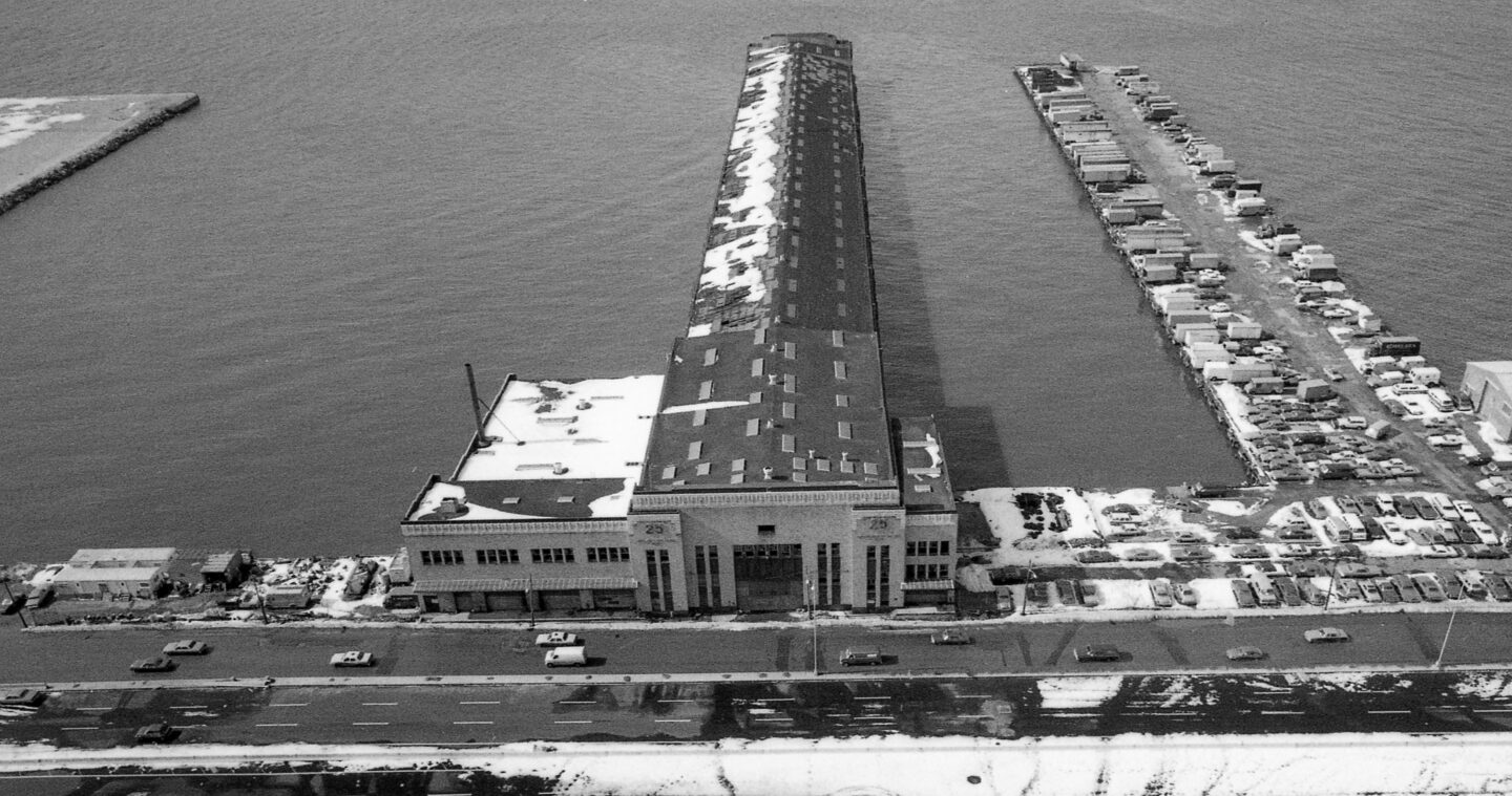 The former building at Pier 25 on the Hudson River, with the parking lot on Pier 26 to the right of the frame.