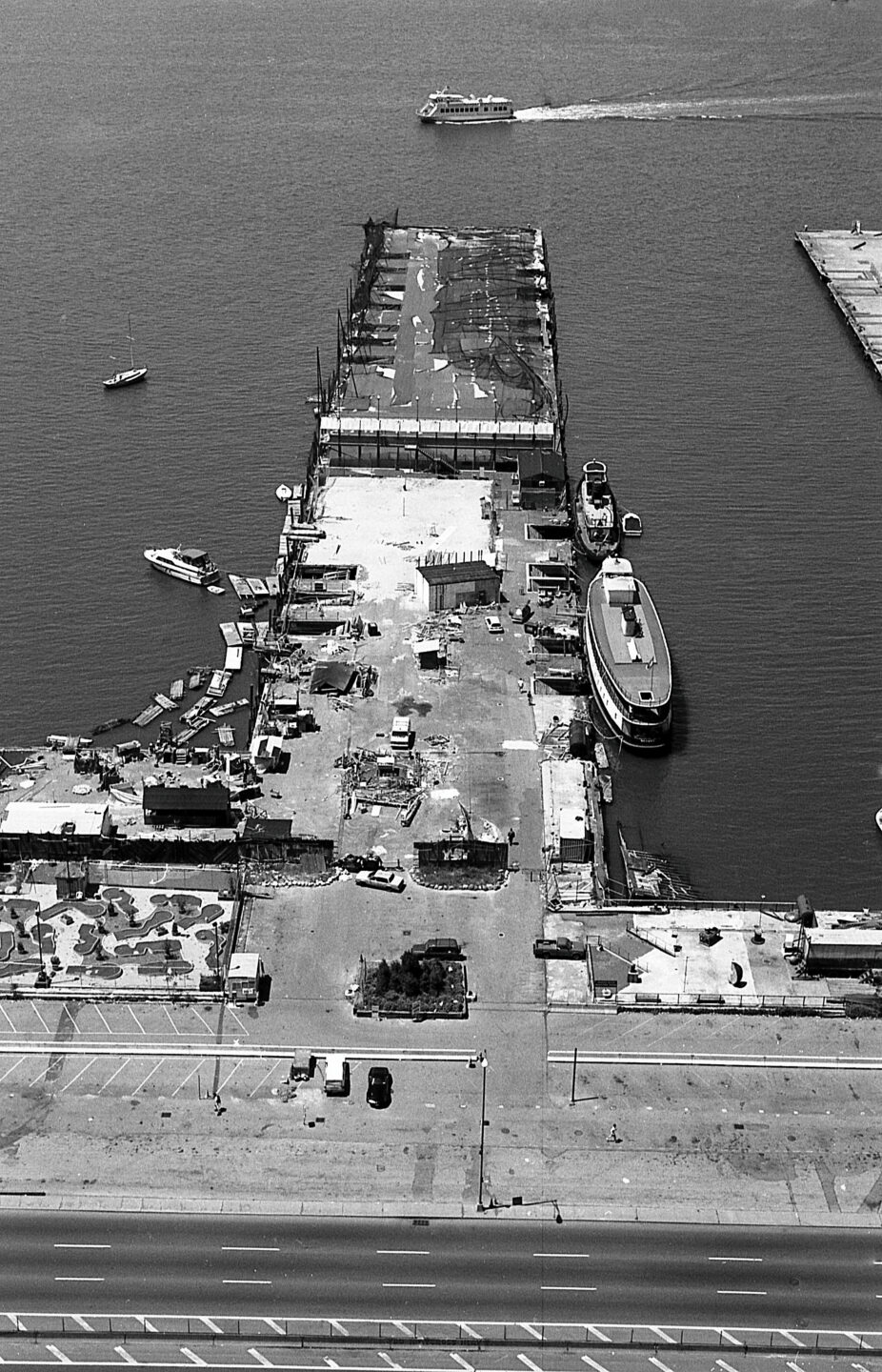 Hudson River Park's Pier 25 in the 1990s or early 2000s, showing the mini-golf course, volleyball courts and driving range.