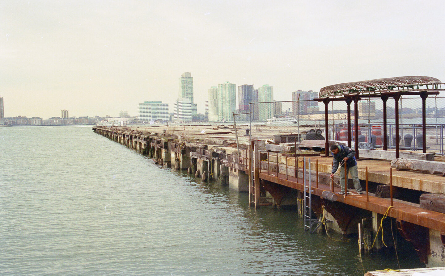 A fisherman pulling up a trap from Pier 26.