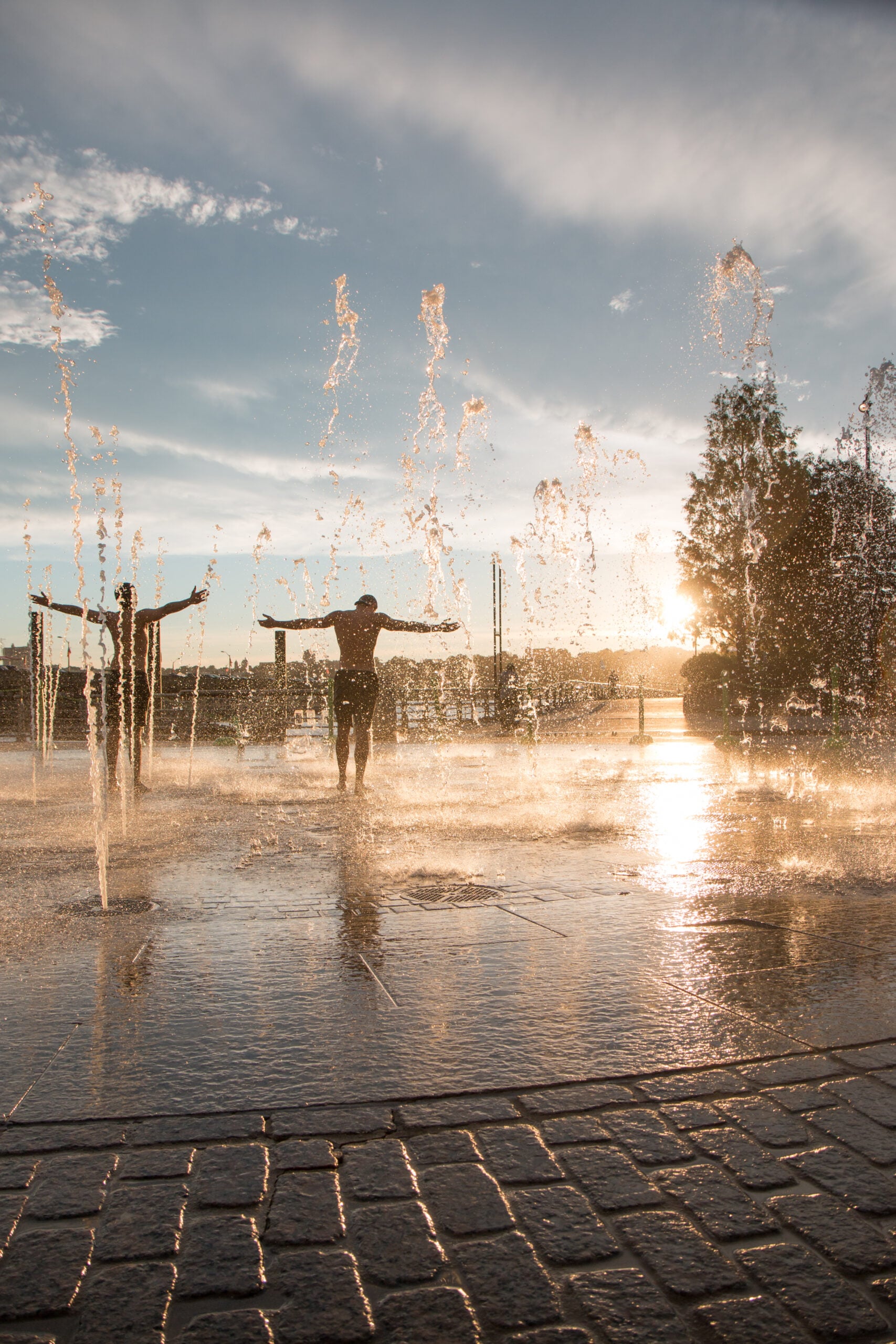 People playing in the fountain at Pier 84