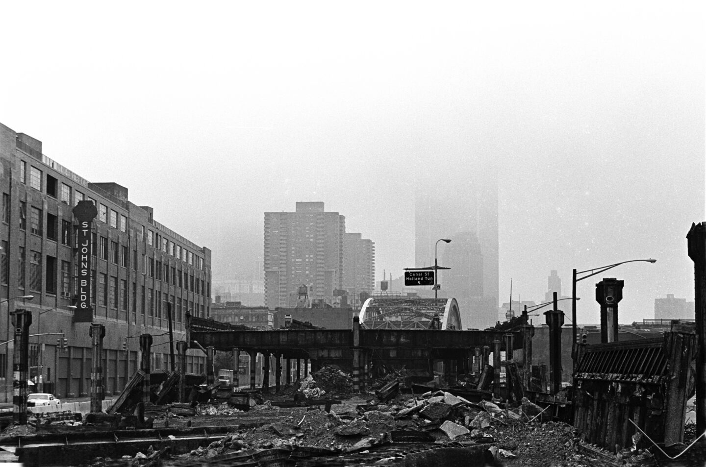 A collapsed section of the elevated West Side Highway viewed from street level.