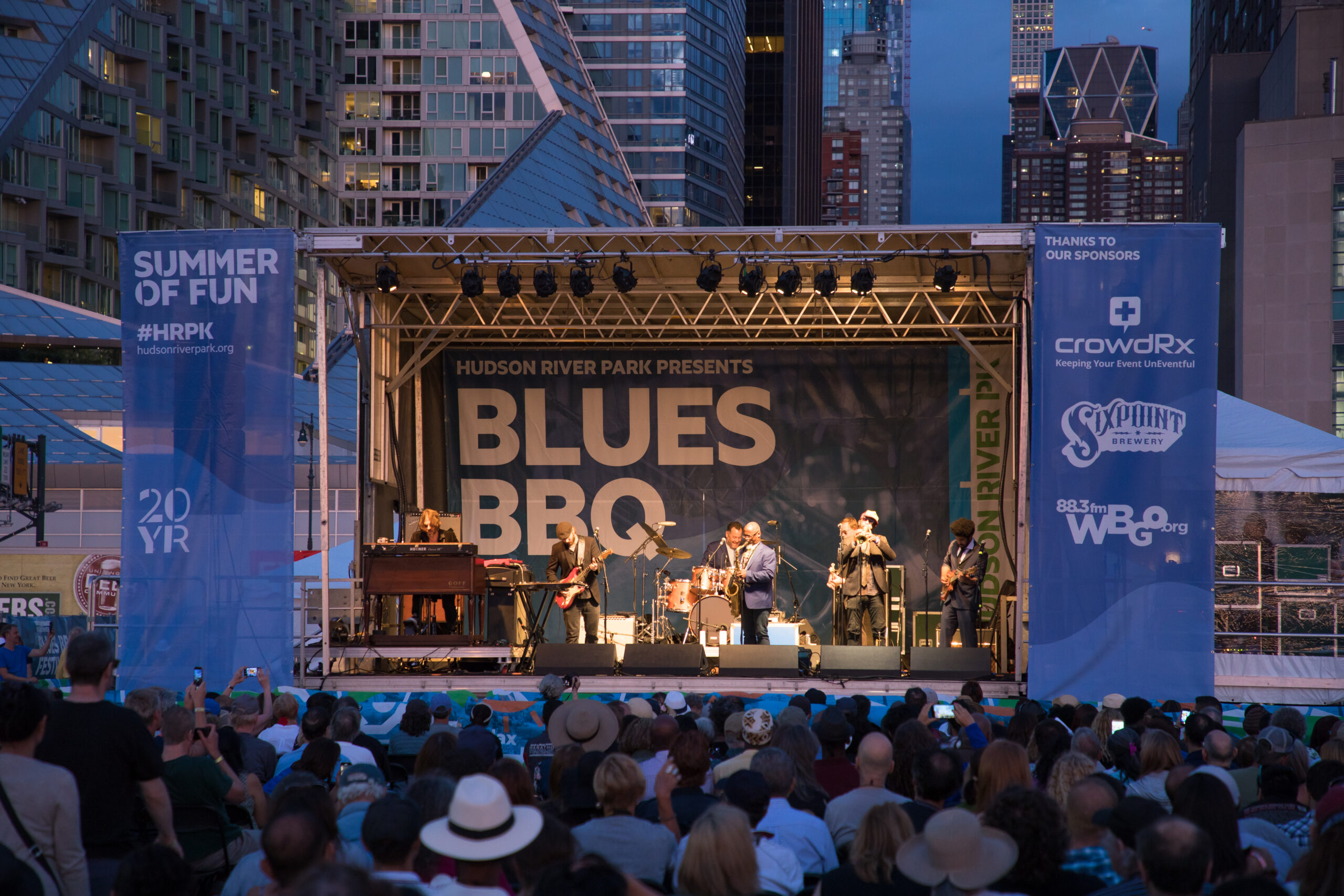 A band performs onstage at the Blues BBQ Festival on Pier 97