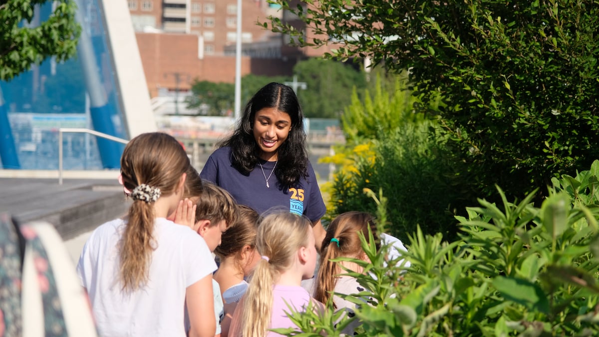 A Hudson River Park staffer leads a group of children on a tour of the Pier 26 Tide Deck