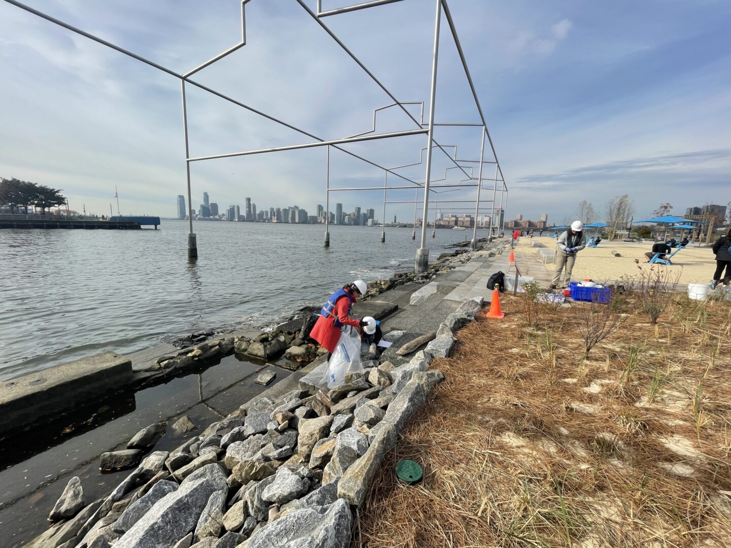 HRPK Blue Team volunteers picking up litter along the Gansevoort Peninsula shoreline