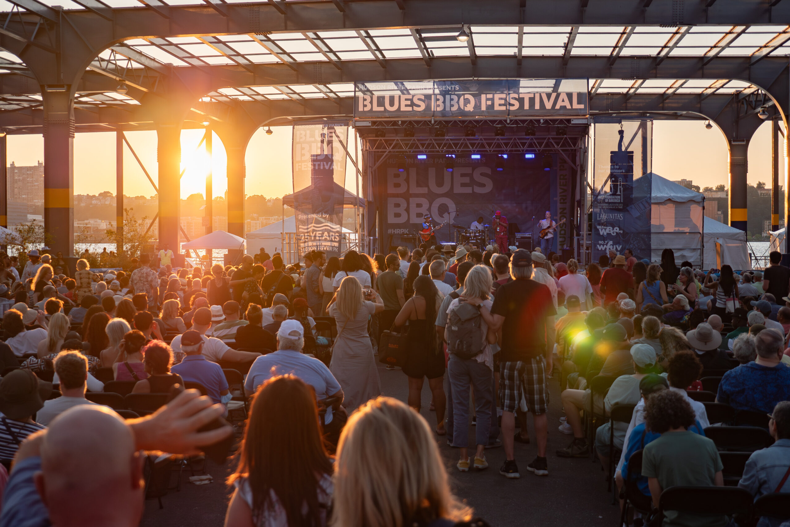 John Primer & The Real Deal Blues Band performing on the Blues BBQ Festival stage at sunset