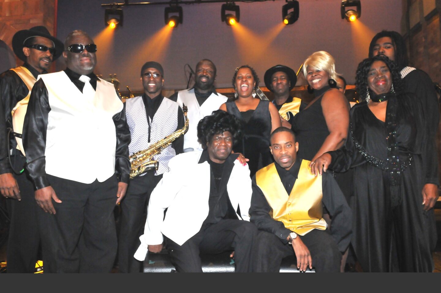 Jimmy Hill and the Allstarz pose for a photo on stage