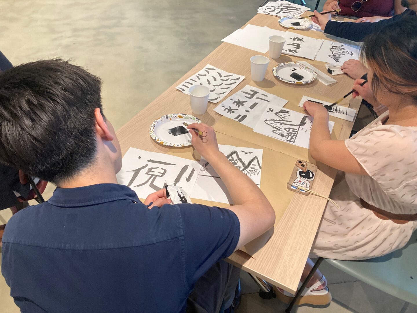 A group of students making art at a Painting Nature event