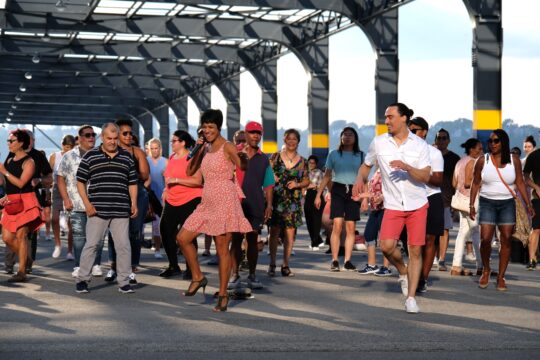 Talía Castro-Pozo leading a Sunset Salsa class on Pier 76