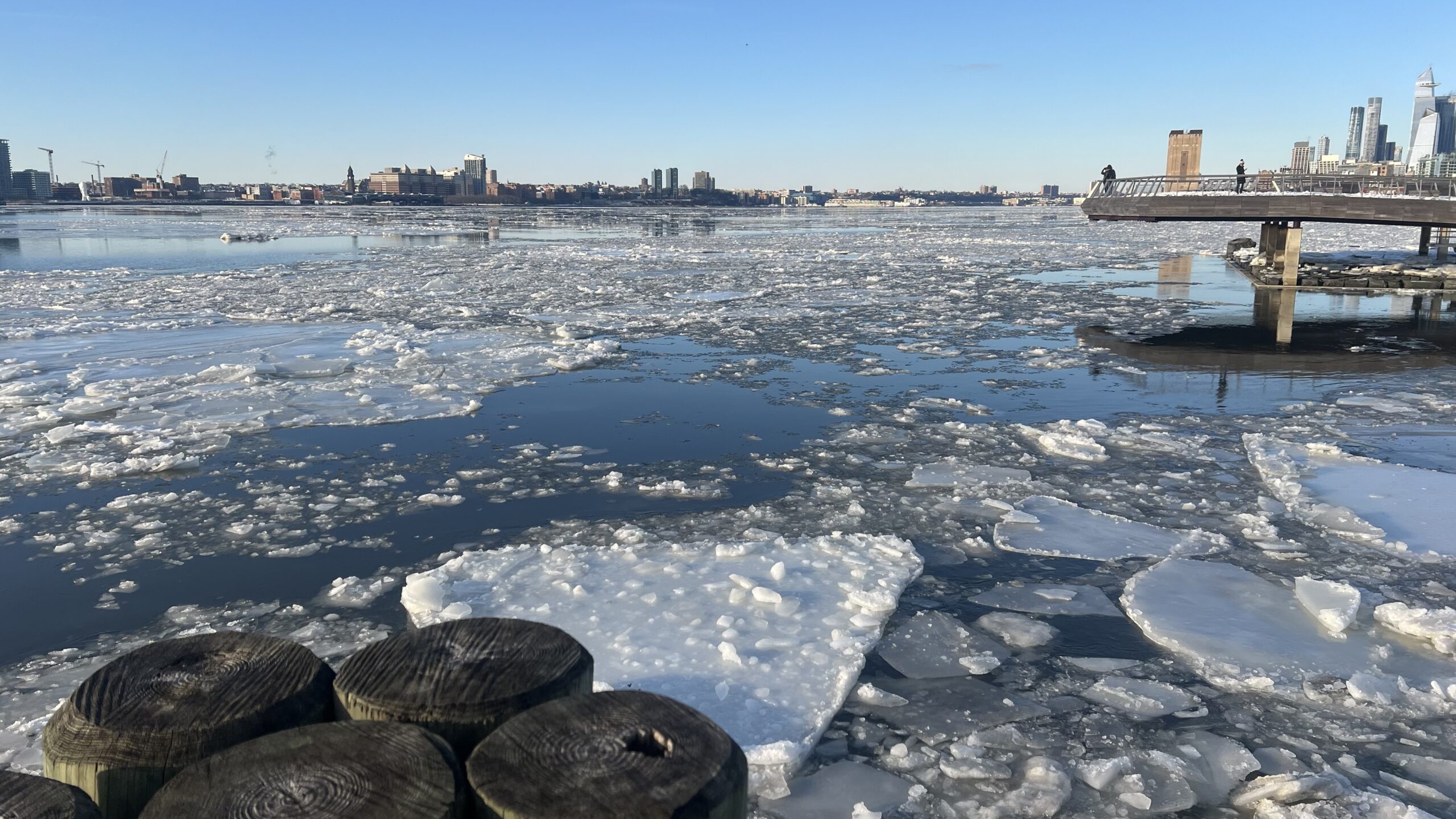 Ice floes on the Hudson River, edge of Pier 26 elevated walkway visible at the right side of hte photo