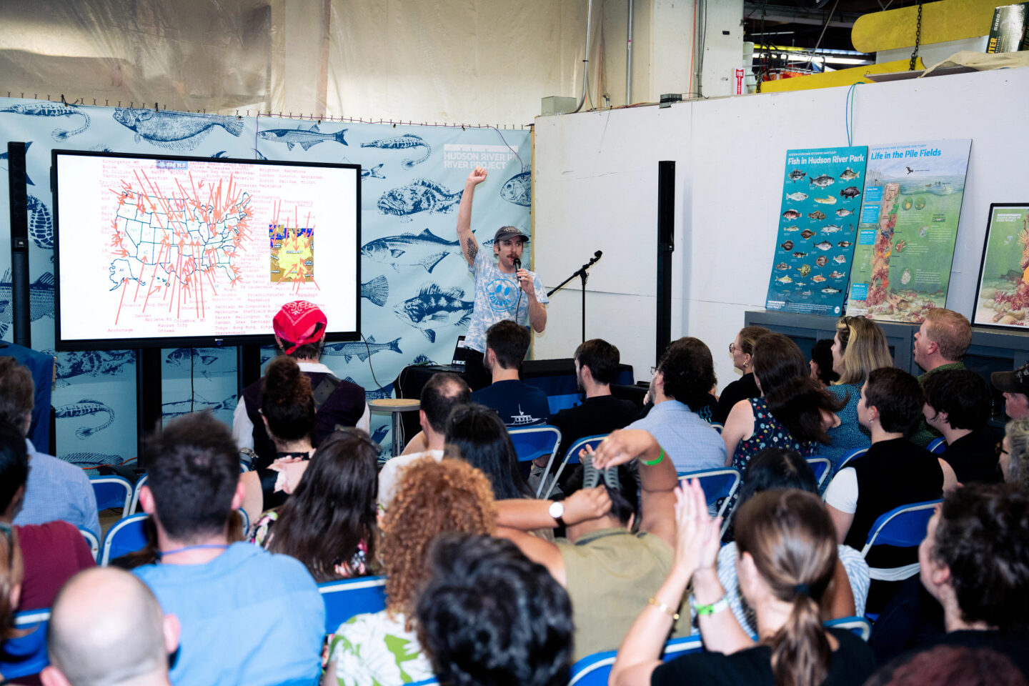 Scientist presenting on stage at HRPK