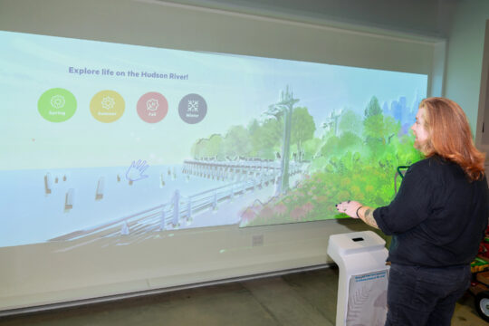 Person in front of a projected image