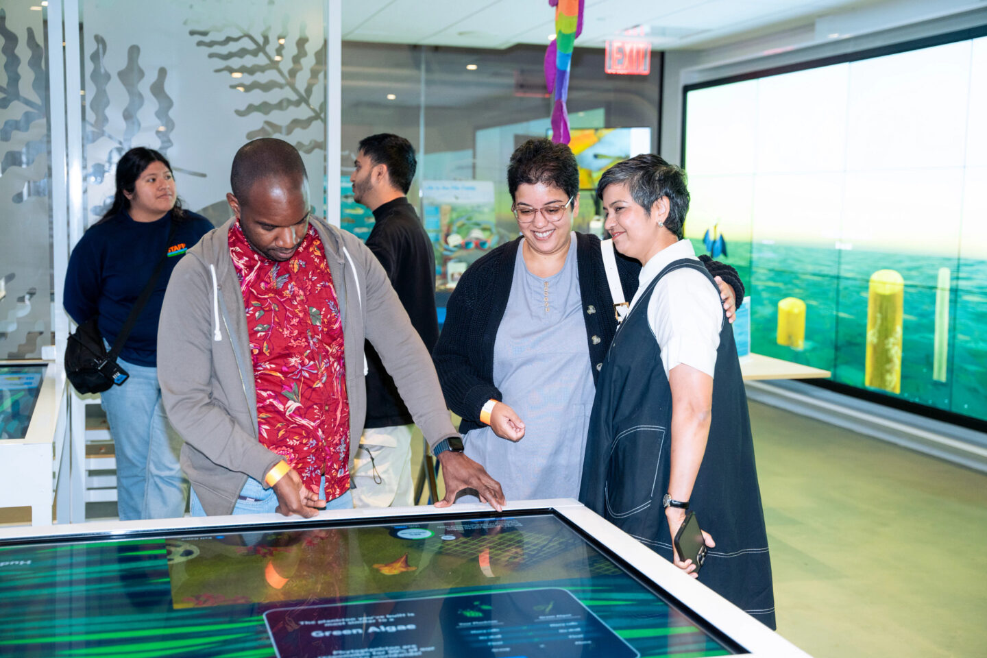 group of people looking at exhibit